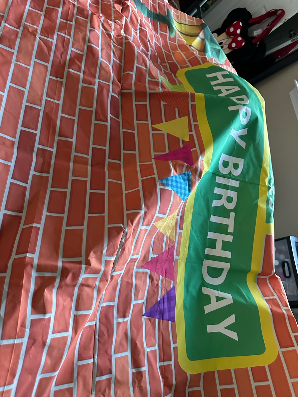 Happy Birthday Brick Wall Table Cover in Orange and Green. Sesame Street themed